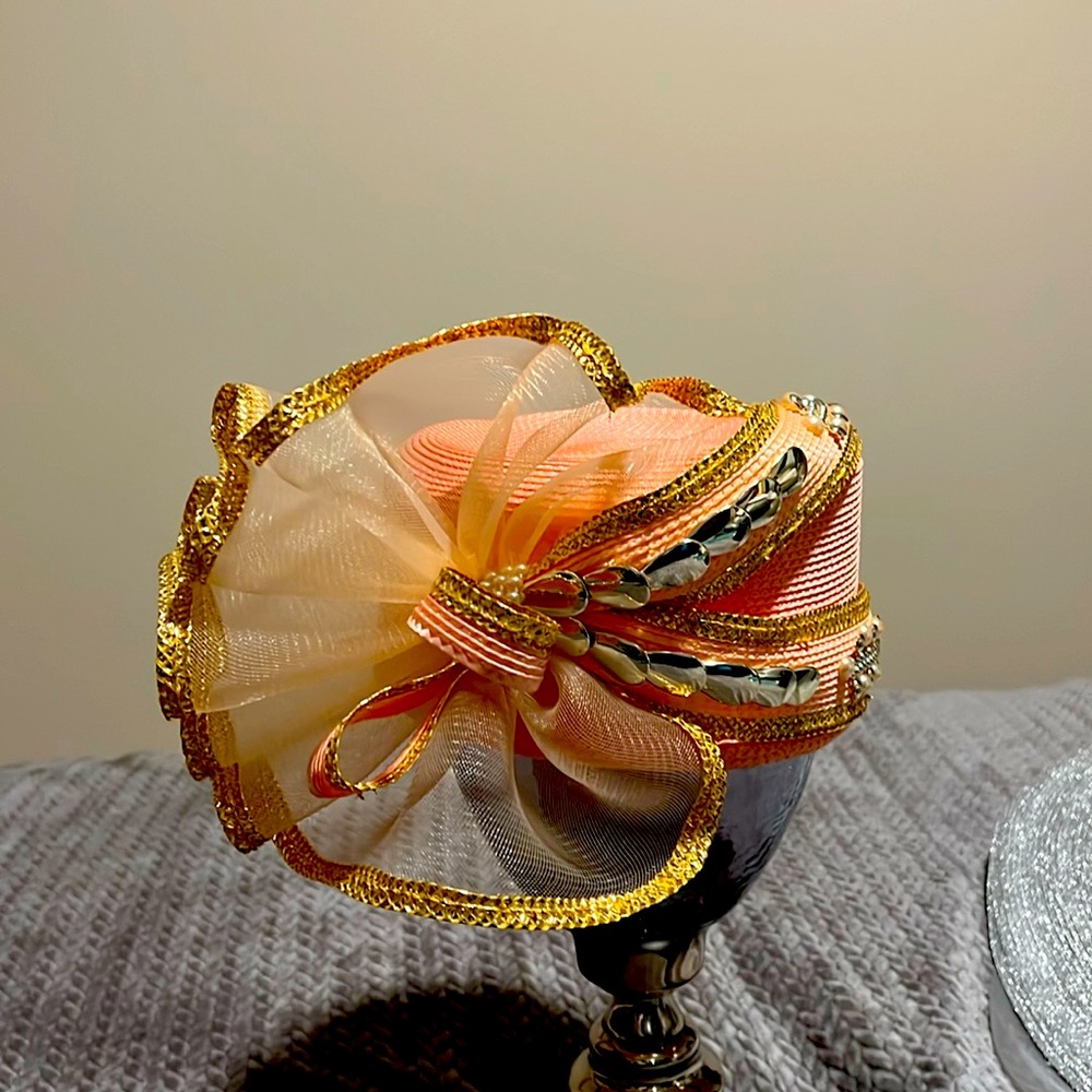 Slightly new, worn 3 times peachy in color was nice designs